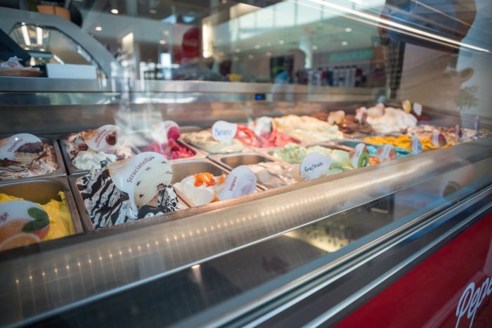 assorted flavor of ice creams inside deep freezer